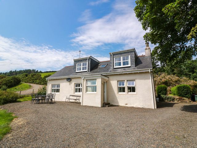 A house with windows and a gravel driveway at Cairnhill in Girvan