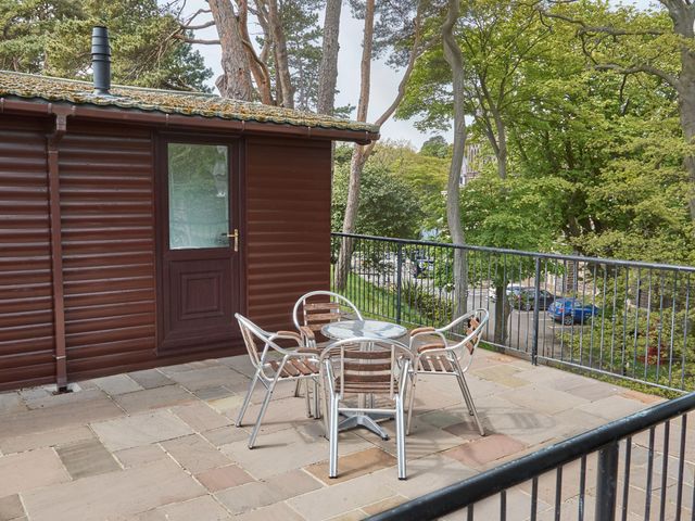 An outdoor space with a table and chairs at Daffodil Lodge Saltburn-by-the-Sea