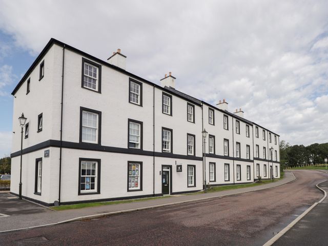 A building with multiple windows and a lamp post at The Nook in Culloden