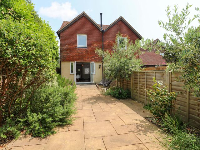 A house with a garden and pathway at 2A The Mews Langstone