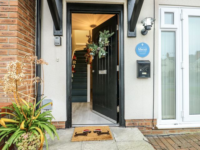 An entrance with a front door and staircase at Coed y Felin in Conwy