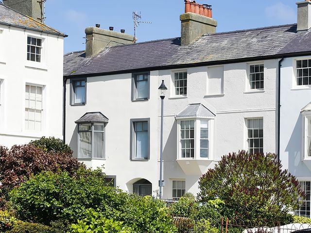 A view of houses and greenery at Tri Raglan Mawr in Beaumaris