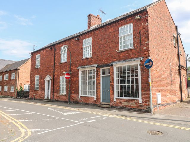 A brick building with windows and a front door at Hambleton House, Castle Donington