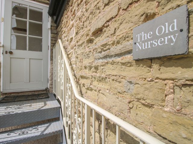 An entrance with stone wall and steps to The Old Nursery in Bourton near Much Wenlock