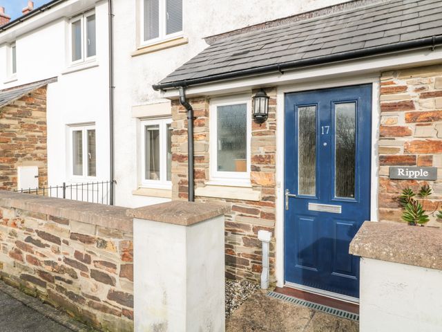 The entrance of a house with a blue door numbered 17 and stone and white walls at Ripple in St Mabyn