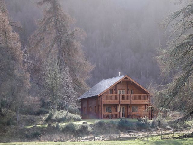 A wooden cabin surrounded by trees in a forested area at Allt Lodge Balnain near Drumnadrochit Loch Ness