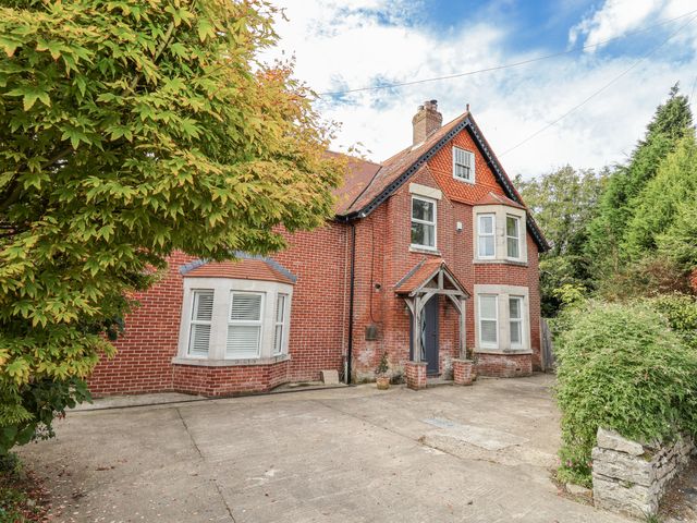 An exterior view of a house with a driveway at 49 Ulwell Road, Swanage
