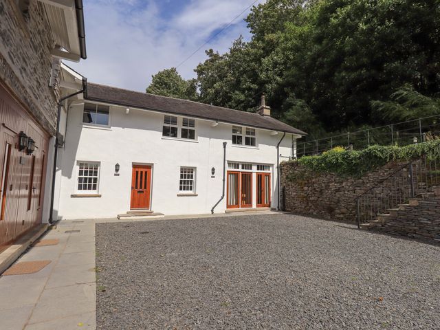 An exterior view of a building with a gravel area at Abbots Reading Mews 2 Grizedale