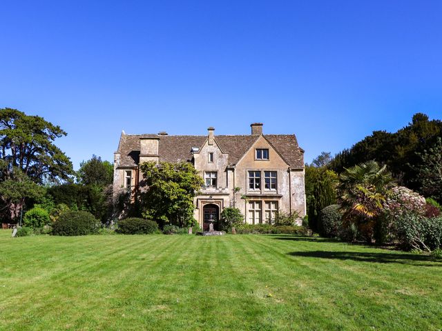 A house with a garden and trees at The West Wing 