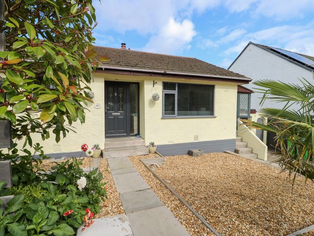 A house entrance with steps and plants at Daisy Cottage Benllech