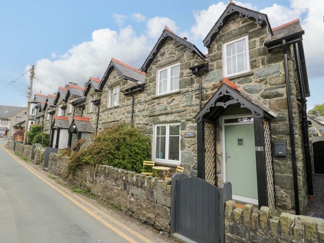 A row of stone houses along a road at Y Bwthyn Llanbedr