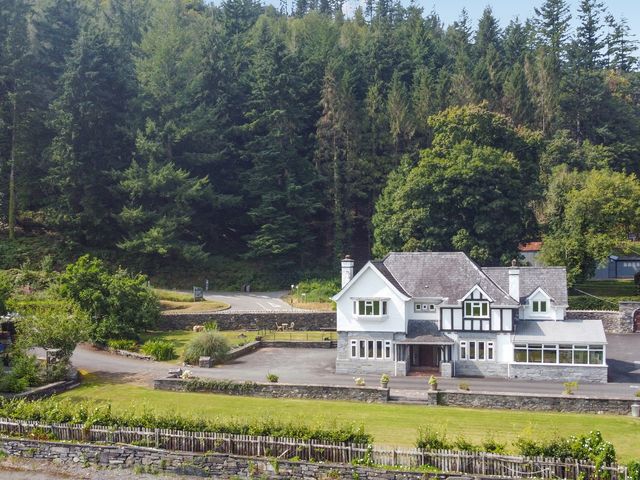 A house surrounded by trees and a driveway at Pengwern Llanrwst