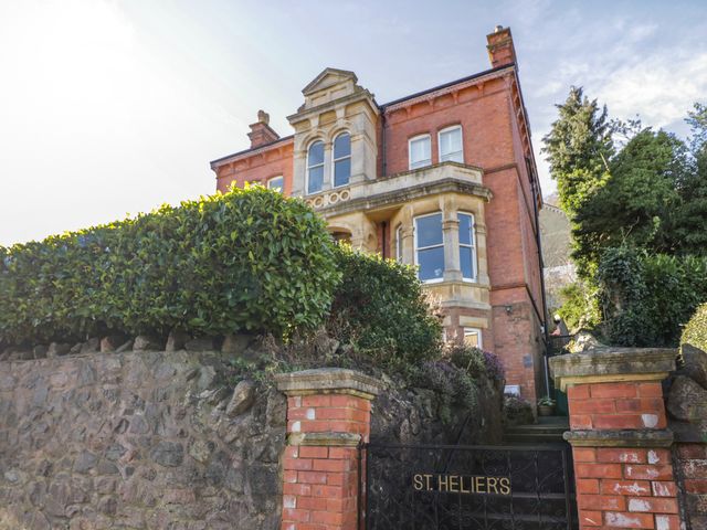 A house with a gate and hedge at St. Helier in Malvern