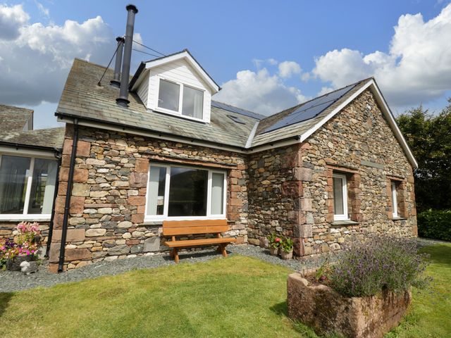 A house with stone walls and a garden at Sherriff, Troutbeck, near Keswick