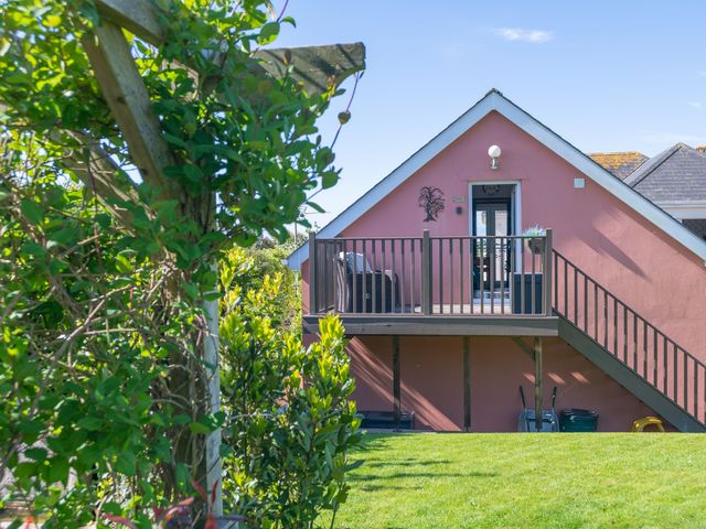 A house with balcony and stairs at Garden View Apartment in Kingsbridge