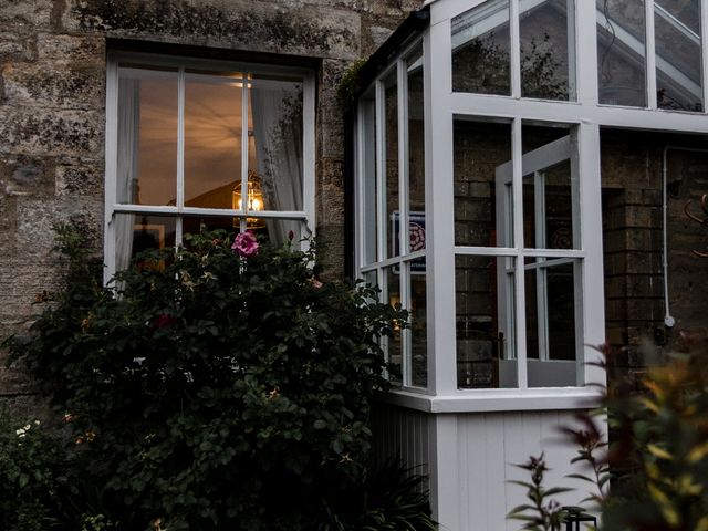 A conservatory with plants and windows at Pendle View Luxury Apartment in Giggleswick near Settle