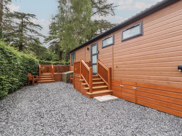 An outdoor area featuring a wooden deck and steps at Beech Grove Lodge Glade 17, Fallbarrow Park near Bowness on Windermere