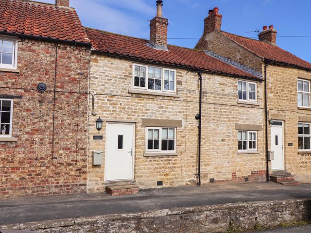 A stone and brick house exterior at Dunning, The Mount, York