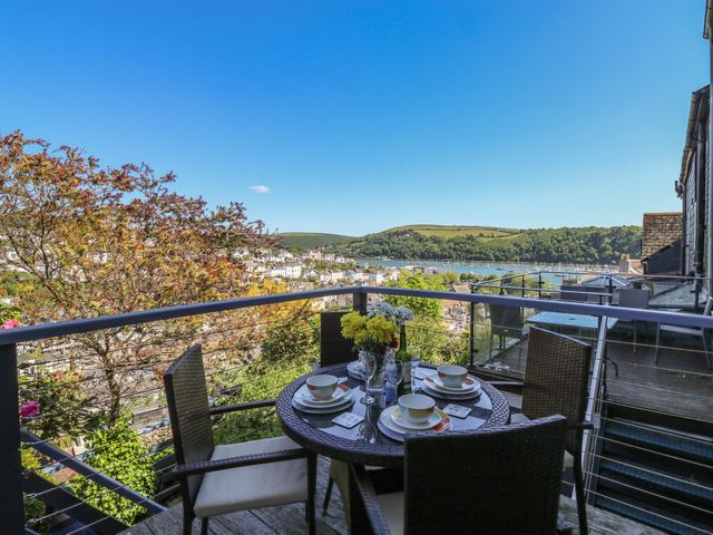An outdoor patio with a table set for dining at 46 Crowthers Hill Dartmouth