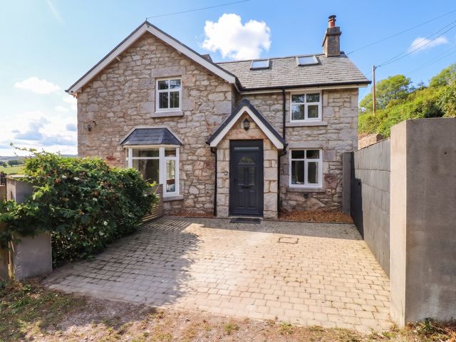 A house with a paved driveway at Tyddyn Elidir near Old Colwyn
