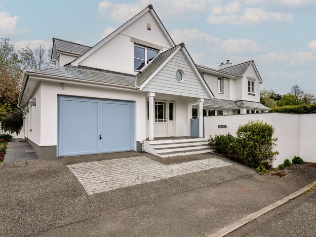 A house with a garage and garden at Cherrytrees in Rock