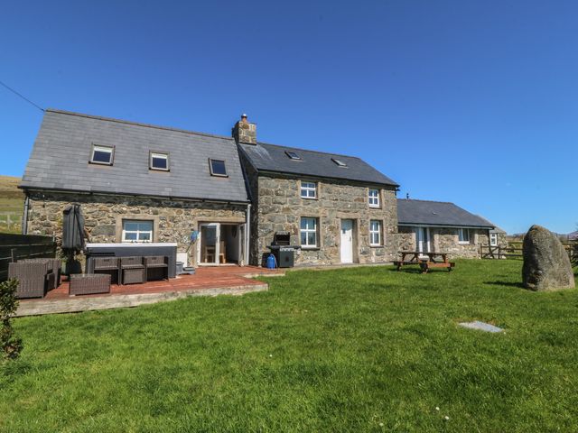 A house with a deck and seating area at Cefnbron Llanaelhaearn near Trefor