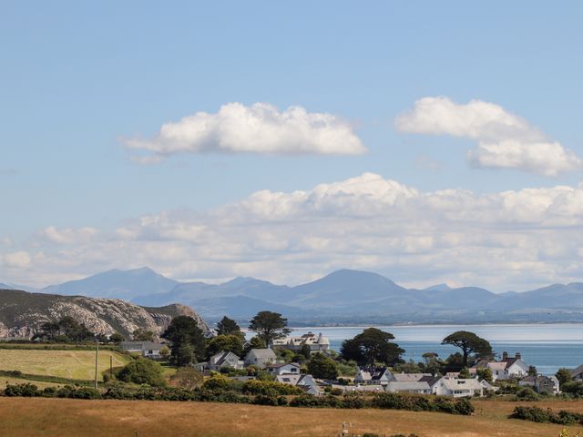A coastal village with houses near water and mountains in the background at The Anchorage in Abersoch