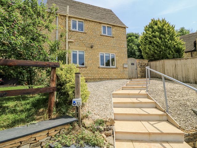 A house with a pathway and steps in front at White Stones in Fulbrook, near Burford