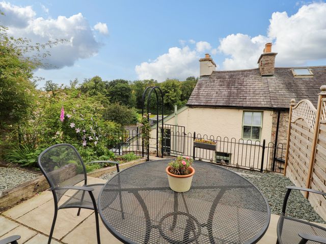 A garden patio with table and chairs at West View Leasgill near Milnthorpe