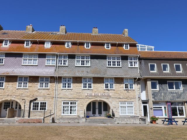 A building with multiple windows and an entrance at The Bay House