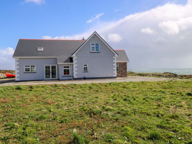 A house near the sea with a garden area at Tí Tom Nárta Trabane near Lettermore, County Galway