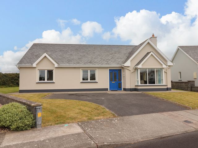 A house with blue door and windows at 29 Church Field in Doonbeg, County Clare