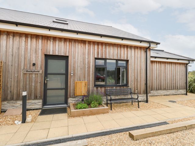 An entrance area with a door and window at Durbyfield in Nottington near Weymouth