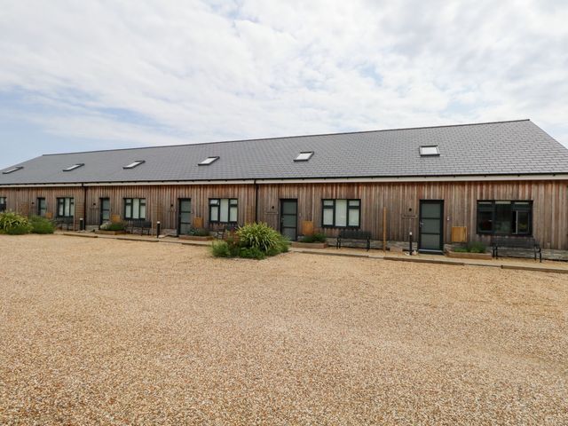 A building with multiple doors and windows at Egdon Heath, Nottington near Weymouth