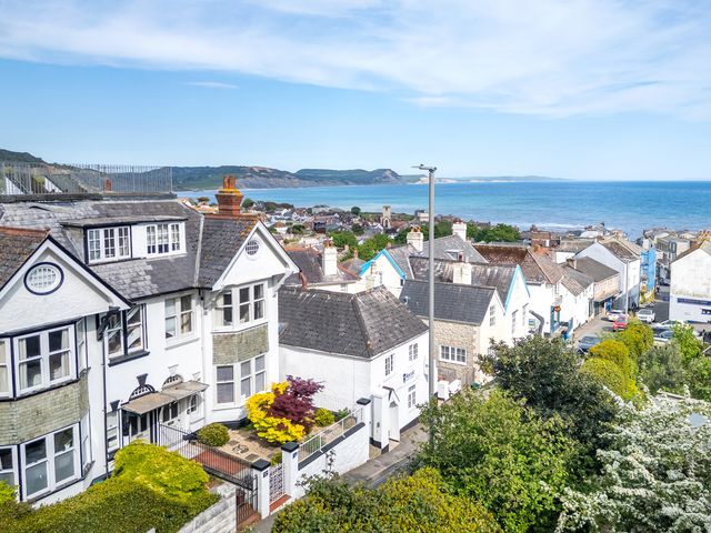 A view of houses and sea at 2 Hadleigh Villas in Lyme Regis