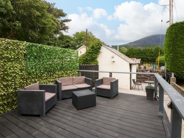 An outdoor seating area with furniture at Y Berth in Caernarfon