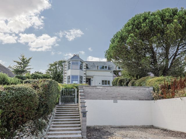 A house with steps and a gate at St Helena, Charmouth
