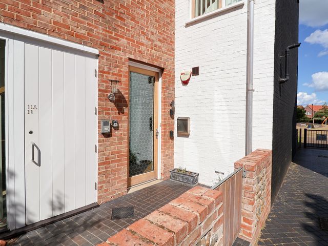 An entrance view with a door and mailbox at The Hive, Southwold