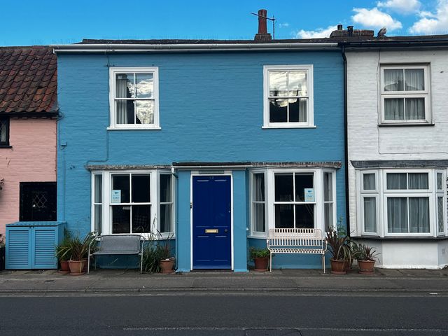 A house with blue and white exterior and a blue door at Seaflower, Aldeburgh