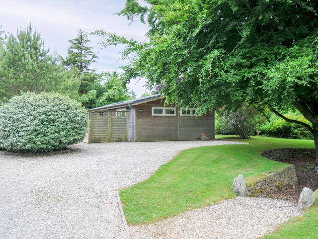 An outdoor area with a gravel driveway and wooden building at 15 Horizon View Dobwalls
