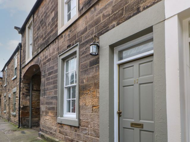 An exterior view of a building with door and window at The Old Smithy in Barnard Castle
