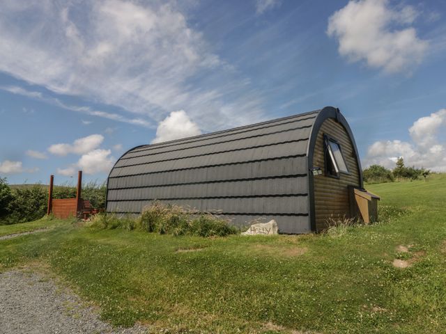 A building in a grassy area at Holly in Ulverston