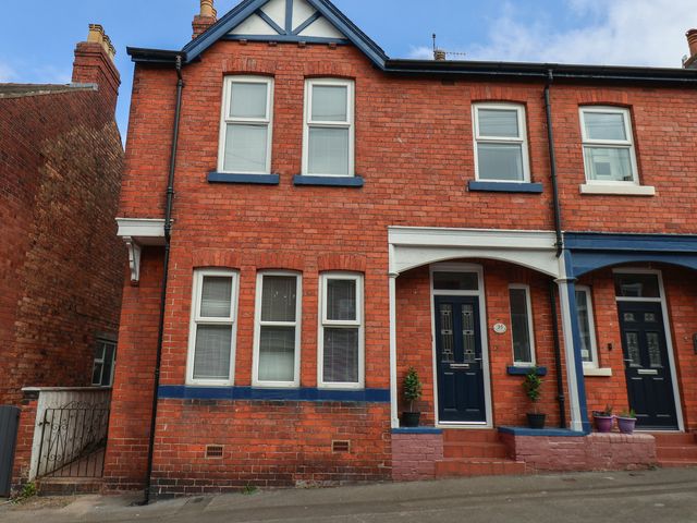 A brick exterior with windows and a door at 35 Moorland Road Scarborough