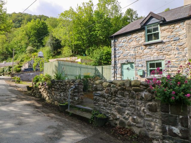 An exterior view of a stone house with garden at Old Chapel House in Abergwyngregyn near Llanfairfechan