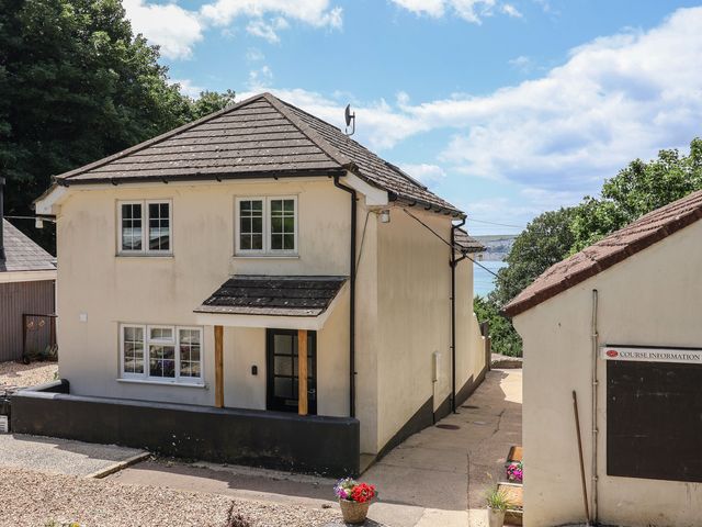 A house with windows and a pathway at Fairview House in Axmouth