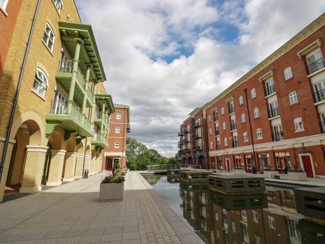 An outdoor area with buildings and water at 63 Vista Heights in Solihull