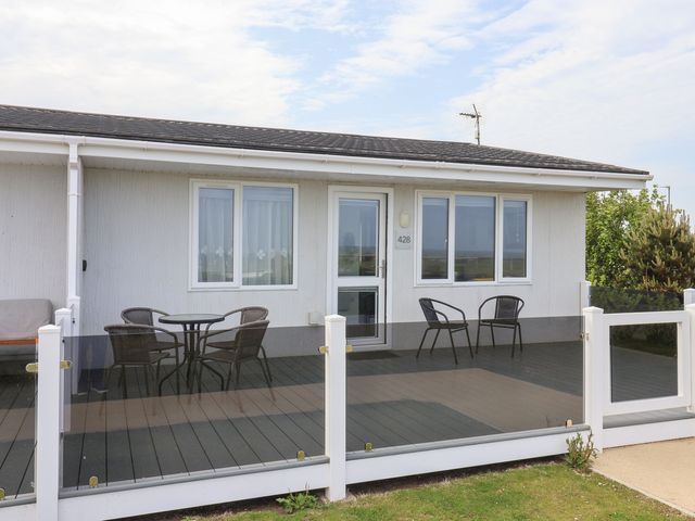 An outdoor area with a deck and seating at Bonny Bay in Wilsthorpe near Bridlington