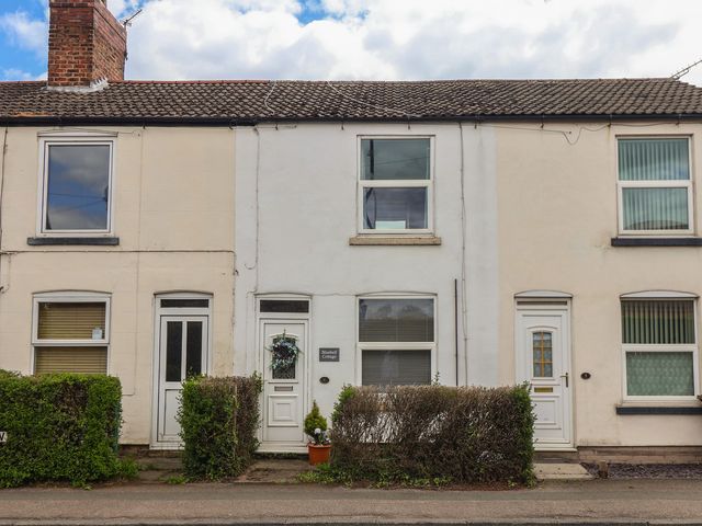 A house with windows and doors at Bluebell Cottage in Brayton