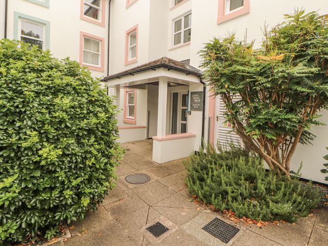 An entrance area with plants and a sign at Flat 17 in Keswick
