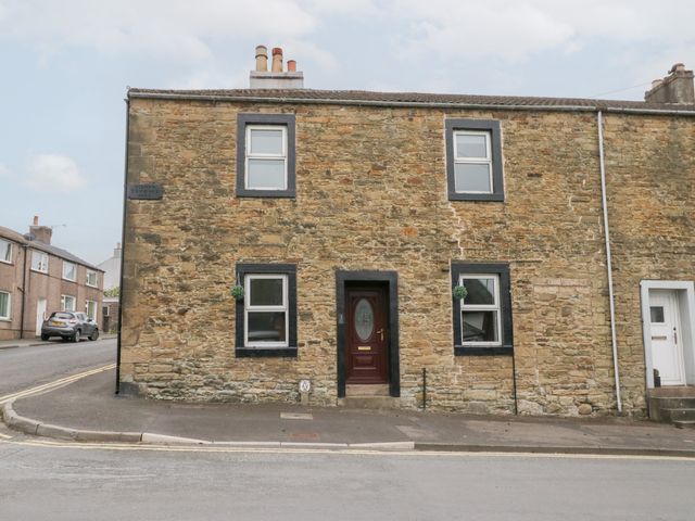 A stone cottage with front door and windows at 3 Nixon Terrace Broughton Moor near Maryport